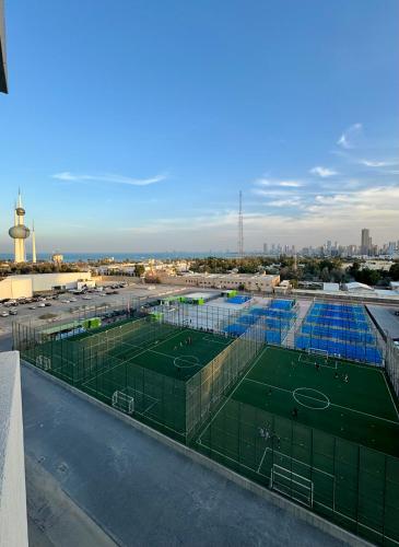 a tennis court on the roof of a building at Dasman 50 in Kuwait