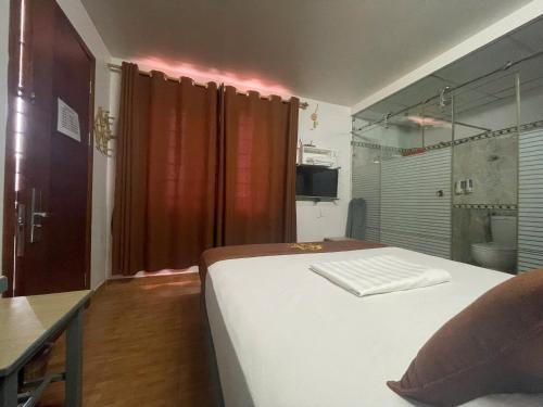 Cama o camas de una habitación en Cozi Hotel