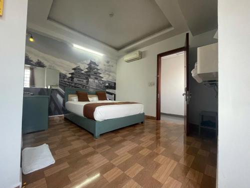 Cama o camas de una habitación en Cozi Hotel