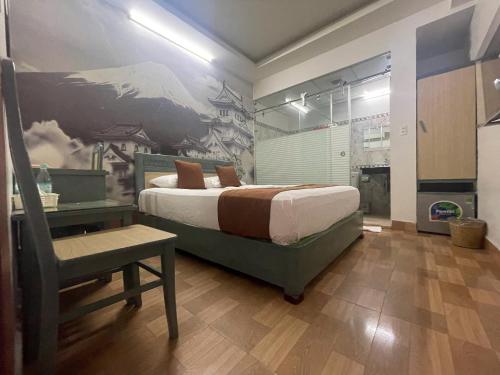 Cama o camas de una habitación en Cozi Hotel