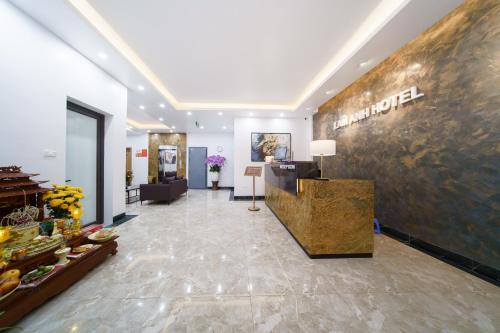 a lobby of a hotel with a sign on the wall at Lam Anh Hotel 4 Ngoại Giao Đoàn BT6-19 in Hanoi