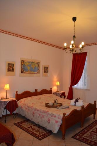 a bedroom with a bed with a sink in it at La Meridiana Affittacamere in Colorno