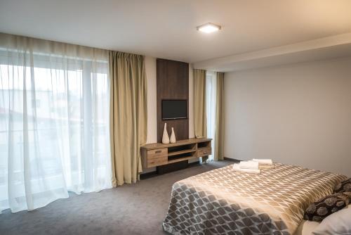 Postel nebo postele na pokoji v ubytování Guest House Frizzante