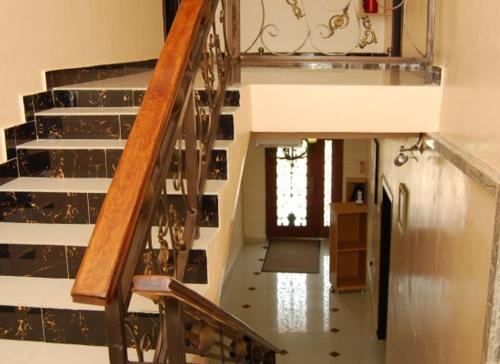 a staircase in a house with a stair case at Auris Court - 2 Bedroom Apartment in Jabi