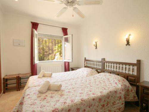 Postel nebo postele na pokoji v ubytování Villa Amaya