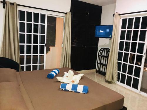 a room with a table with towels on it at 5th Avenue 3 people Balcony Apartment in Playa del Carmen