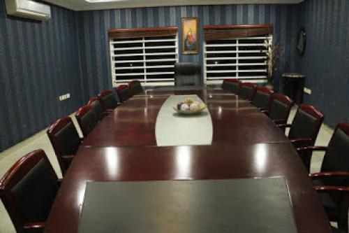 a large conference room with a long table and chairs at All Seasons Hotel - Executive in Owerri