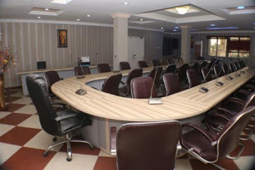 a large conference room with a long table and chairs at All Seasons Hotel - Executive in Owerri