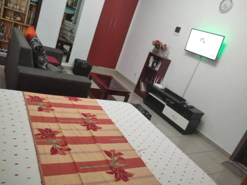 a living room with a bed and a couch at Magnifique Studio Meuble in Abidjan