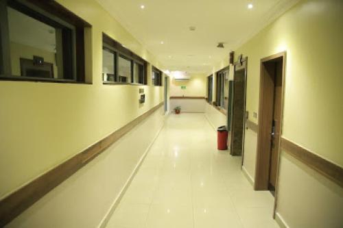 an empty hallway of a building with a hallway at Best Western Plus-presidential Suite in Ibadan