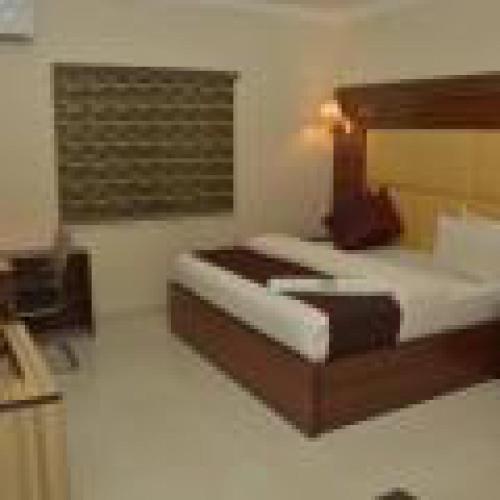 a rendering of a bedroom with a bed in it at Habitat Hotel and Suites -Standard in Port Harcourt