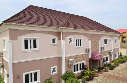 a house with a brown roof at Auris Court - Economy in Jabi