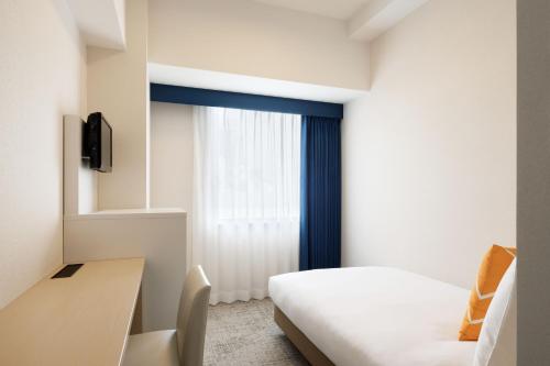 Postel nebo postele na pokoji v ubytování Four Points Flex by Sheraton Hakodate Station
