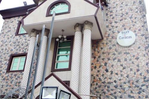 a building with columns and a window on it at Suite Las Caracas-yaba in Lagos