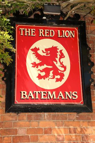 a red lion sign on the side of a brick wall at The Red Lion in Revesby
