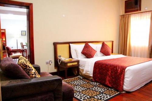 Ένα ή περισσότερα κρεβάτια σε δωμάτιο στο The Chelsea Hotel Abuja