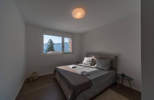Ένα ή περισσότερα κρεβάτια σε δωμάτιο στο Brand New Apartment In The Heart Of Lugano City 10