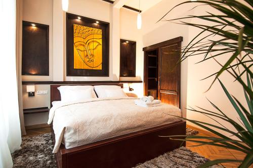 Cama o camas de una habitación en Premium Buddha Apartment