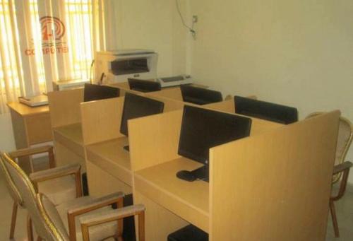 a room with a bunch of tables and chairs at Ayalla Hotel Suites-yenogoa Royal Room in Port Harcourt