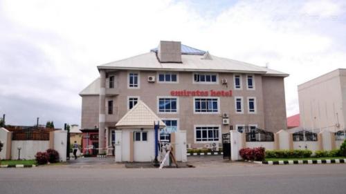 a building with a sign on the front of it at New Blue Diamond Hotel - rosebud in Jabi