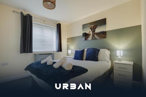 two beds in a bedroom with the words ukran at Perfect Contractor House 3 Bedroom Sleeps 7 in Peterborough