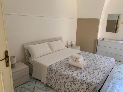 Postel nebo postele na pokoji v ubytování Palazzo De Donno Apartment 4