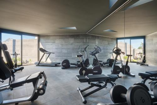 a gym with treadmills and exercise bikes in a room at La Isla y el Mar, Hotel Boutique in Puerto del Carmen
