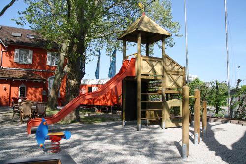 a park with a playground with a slide at Hotel Beim Schupi Karlsruhe in Karlsruhe