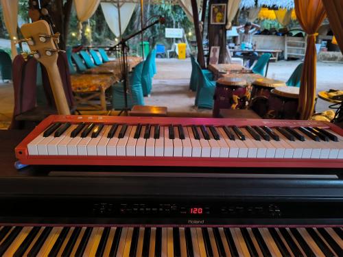 a piano sitting on top of a table at KRABI BAMBOO KINGDOM at AOLUEK PARADISE in Ao Luk