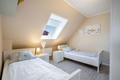 Postel nebo postele na pokoji v ubytování Ferienhaus Rose