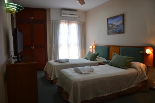 Ένα ή περισσότερα κρεβάτια σε δωμάτιο στο Hotel Algeciras