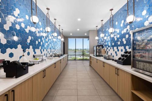 a restaurant with blue and white tiles on the wall at La Quinta Inn & Suites by Wyndham Yuma in Yuma