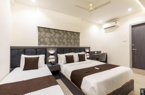 Krevet ili kreveti u jedinici u okviru objekta Hotel Artilla Mumbai
