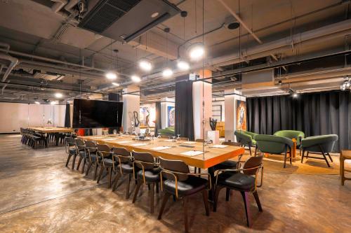 a large conference room with a long table and chairs at Radisson RED Phuket Patong Beach in Patong Beach