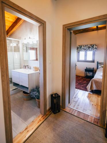a bathroom with a sink and a mirror at Alexi's House in Kalavrita