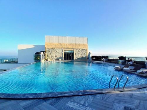 a large swimming pool on the roof of a building at Apec Sun Condotel Tuy Hoà - Sea View in Phước Hậu