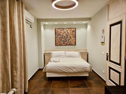 a bedroom with a bed and a painting on the wall at Ai Poeti in Brescia