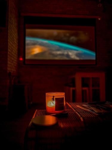 a candle sitting on a table in a dark room at Heart of the City: Cozy 2-Bed Loft in Winnipeg