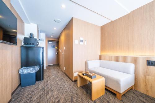 Postel nebo postele na pokoji v ubytování Apartment Hotel 11 Namba Minami 4