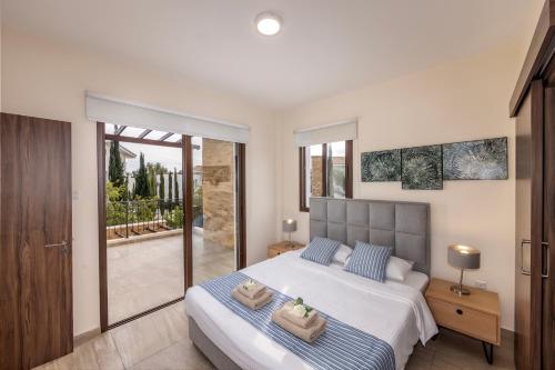 Ένα ή περισσότερα κρεβάτια σε δωμάτιο στο villa Ionion H32