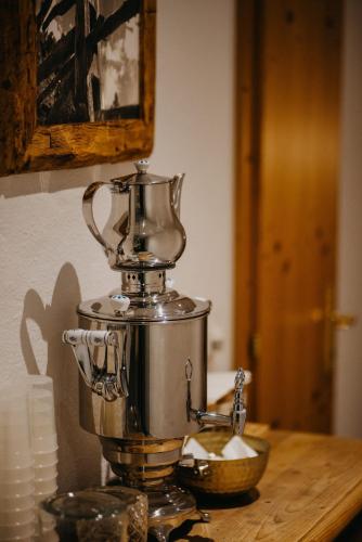 a mixer sitting on top of a wooden table at Hotel Alpin Tyrol - Kitzbüheler Alpen in Sankt Johann in Tirol