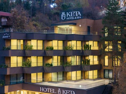 a hotel is lit up at night at Keta Hotel & Spa - Mavrovo in Mavrovo