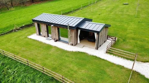an overhead view of a small building in a field at Cabañas O Recuncho do Sor in O Barqueiro