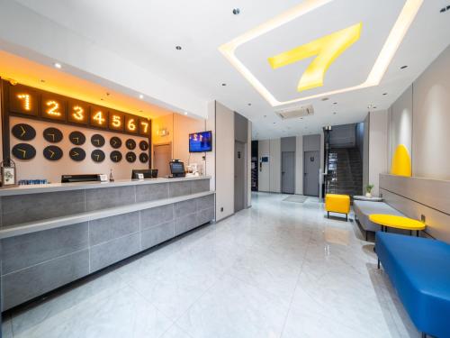a lobby of a fast food restaurant with a sign on the ceiling at 7Days Inn Railway Station Xi'an Wulukou Subway Station in Xi'an