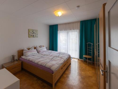 Un pat sau paturi într-o cameră la Ferienhaus Villa Korn