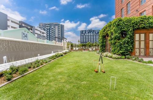 a artificial lawn with two croquet balls on it at 54 on Bath, Johannesburg Rosebank in Johannesburg