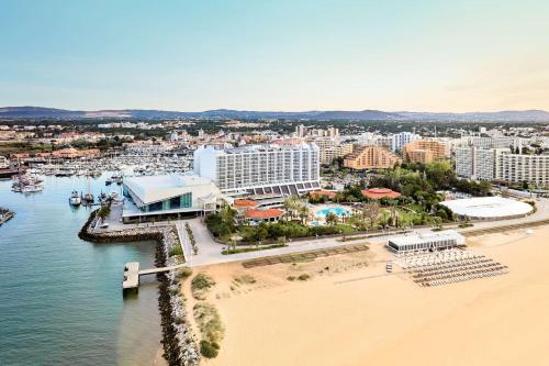 an aerial view of a resort and a beach at Tivoli Marina Vilamoura in Vilamoura