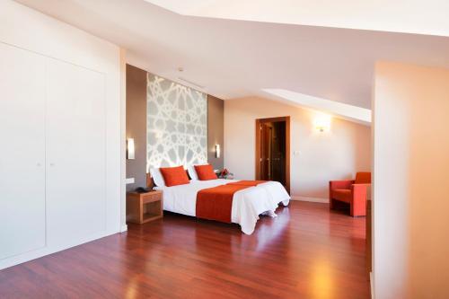 Cama o camas de una habitación en Hotel Granada Palace