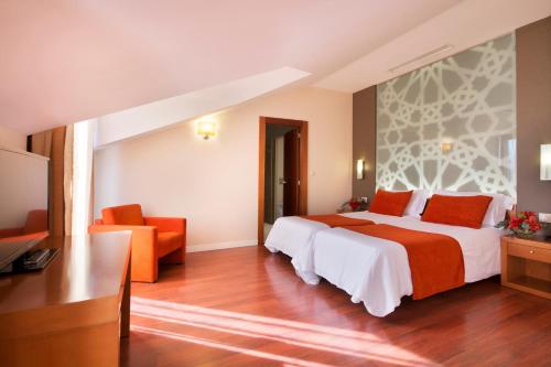 Cama o camas de una habitación en Hotel Granada Palace