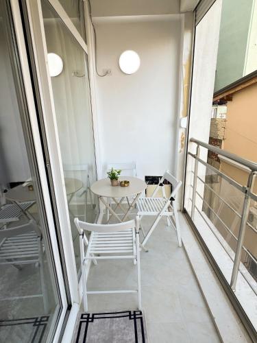 a balcony with a table and chairs on it at Sea View Apartments in Durrës